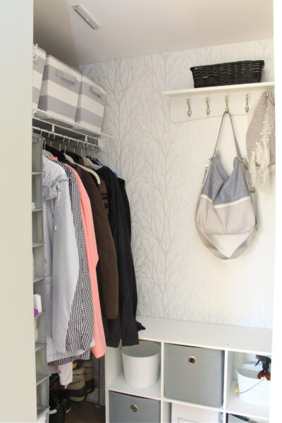 Organized and pretty front entry closet with peel and stick wall paper.
