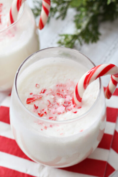 Creamy peppermint punch with crushed candy canes as garnish.