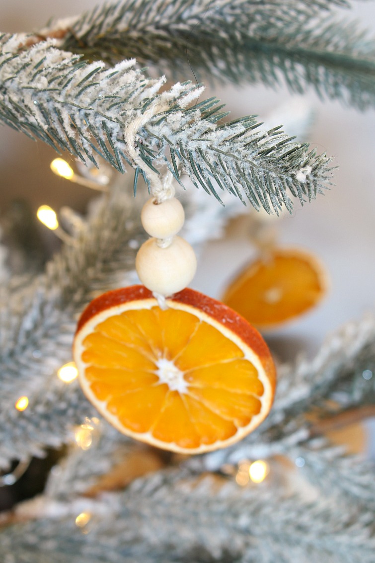 DIY dried orange Christmas ornaments with wood beads.