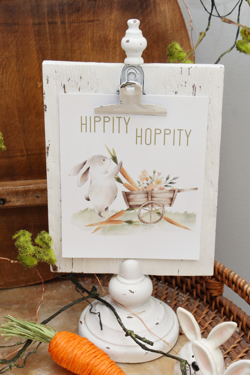 Hippity Hoppity free Easter printable in a white clipboard style frame.