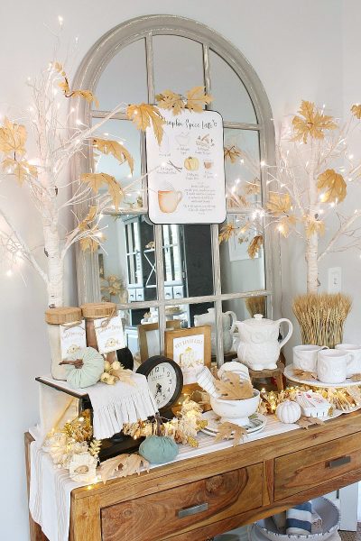 Pretty fall hot beverage bar decorated in muted fall colors.
