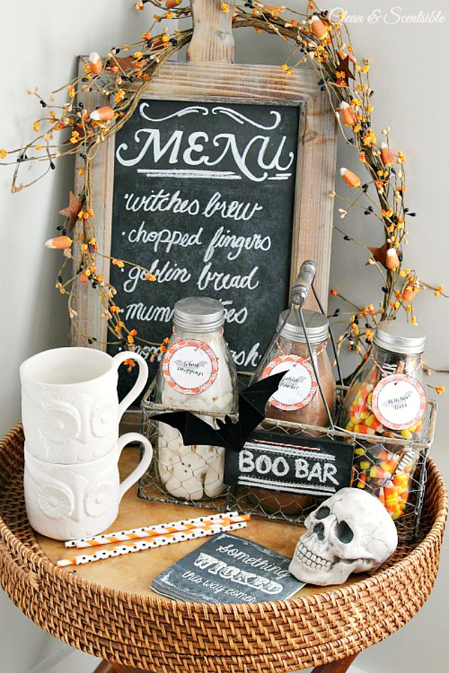 Cute Halloween hot chocolate bar with milk bottles in a crate.
