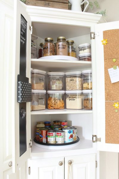 OXO airtight food storage containers in a corner lazy susan cabinet.