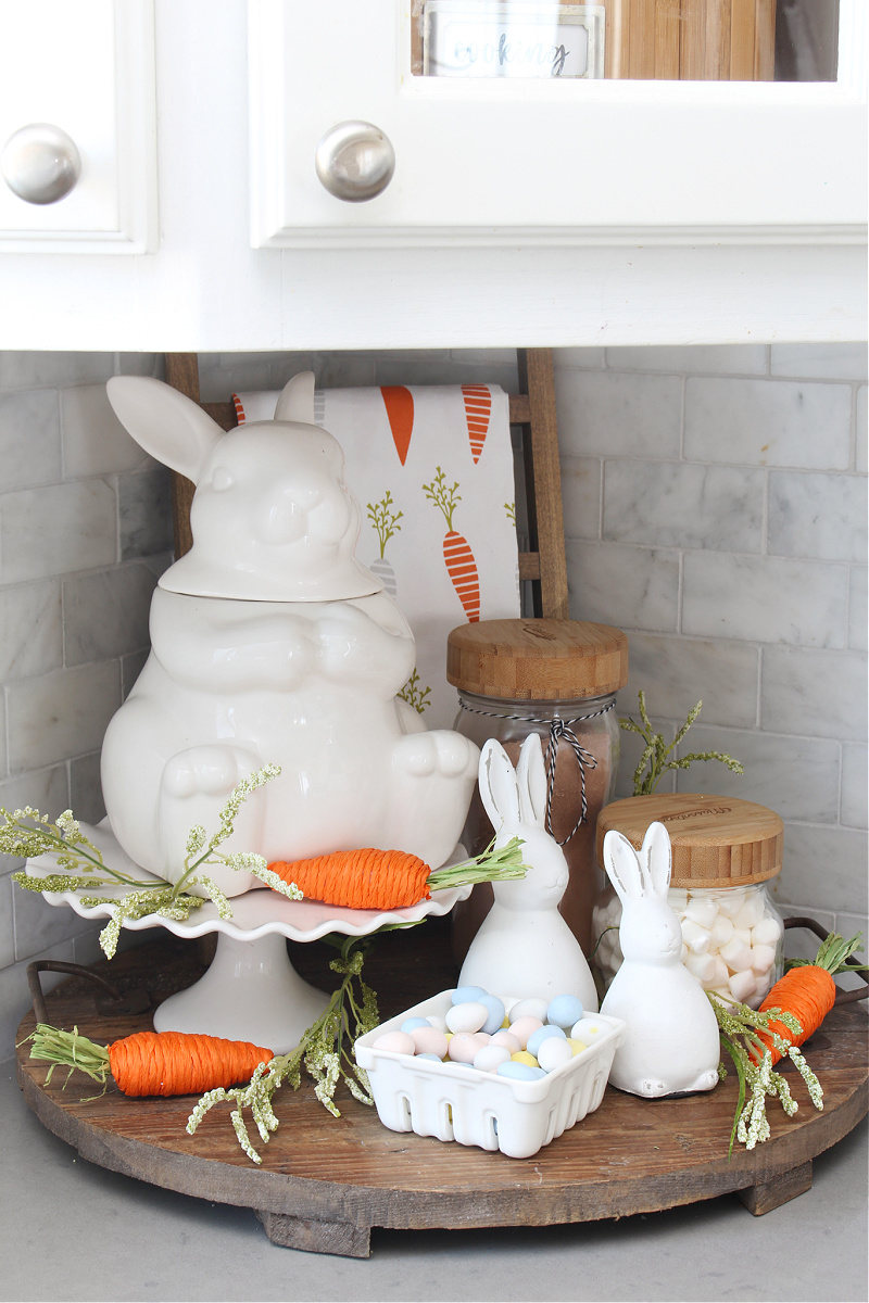 Cute white bunny and carrot Easter vignette.