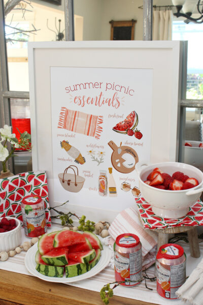 Summer Picnic Essentials free printable displayed on a side board.